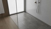 Évacuation douche italienne : normes, pente et prix 2026