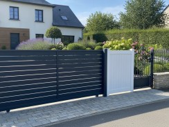Portail alu, PVC ou fer 2026 : comparatif prix et choix